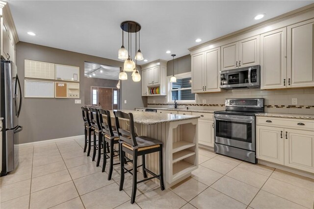 44868 Warner Rd, Pa, PA 16354 - kitchen with appliances with stainless steel finishes, open shelves, a kitchen island, a breakfast bar area, and light stone countertops