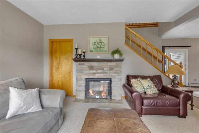 44868 Warner Rd, Pa, PA 16354 - living room with carpet floors, stairway, a baseboard radiator, and a stone fireplace