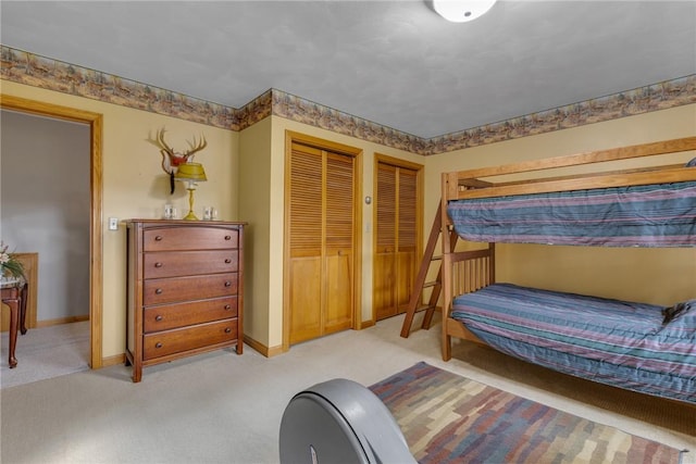 44868 Warner Rd, Pa, PA 16354 - carpeted bedroom featuring two closets and baseboards