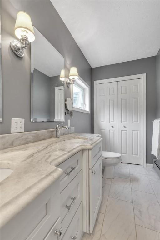 44868 Warner Rd, Pa, PA 16354 - bathroom featuring double vanity, marble finish floors, and toilet