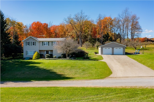 view of front facade featuring a front yard, an outbuilding, and a garage