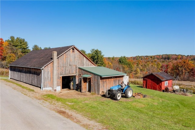 44868 Warner Rd, Pa, PA 16354 - view of pole building with a lawn, a wooded view, and driveway