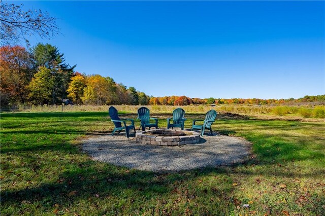 44868 Warner Rd, Pa, PA 16354 - view of grassy yard featuring an outdoor fire pit