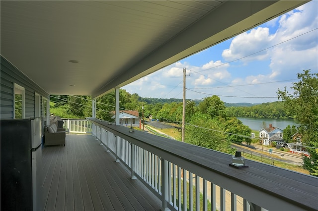 wooden terrace with a water view