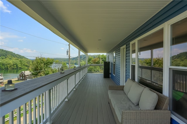 wooden deck featuring a water view