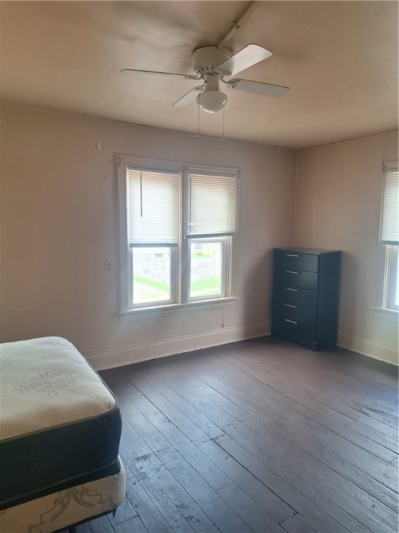 bedroom with ceiling fan and hardwood / wood-style floors