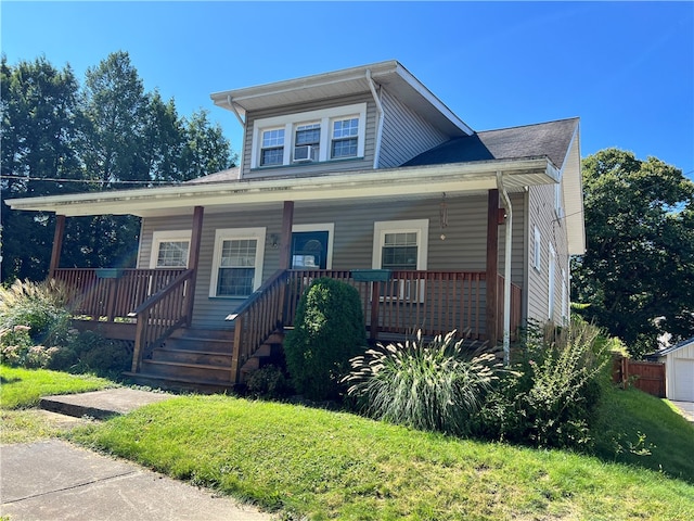 bungalow-style home with a front yard and a porch