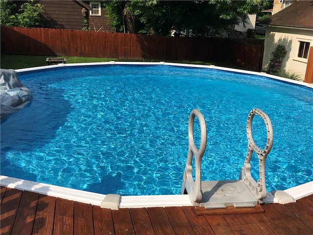 view of pool with fence and a fenced in pool