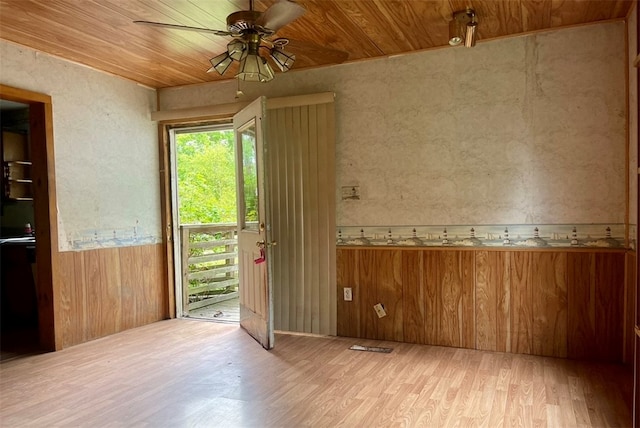 doorway to outside featuring wood ceiling, hardwood / wood-style floors, and ceiling fan