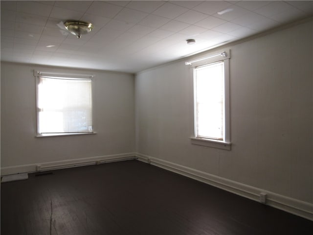 empty room featuring dark wood-type flooring