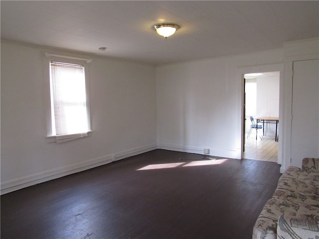 spare room with dark hardwood / wood-style flooring