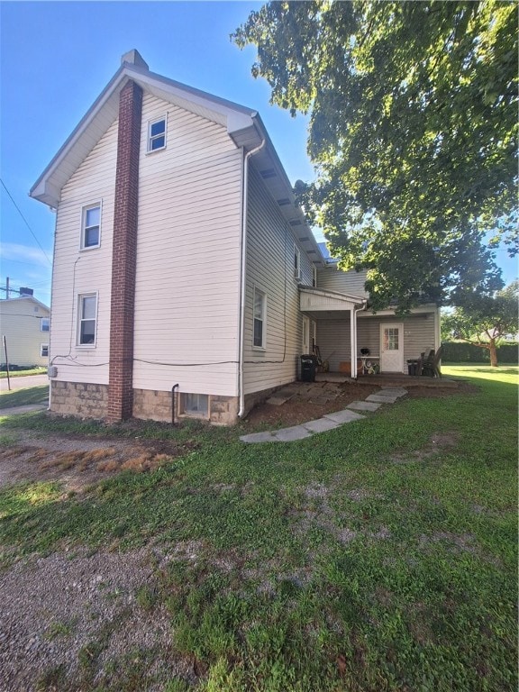 view of property exterior featuring a yard