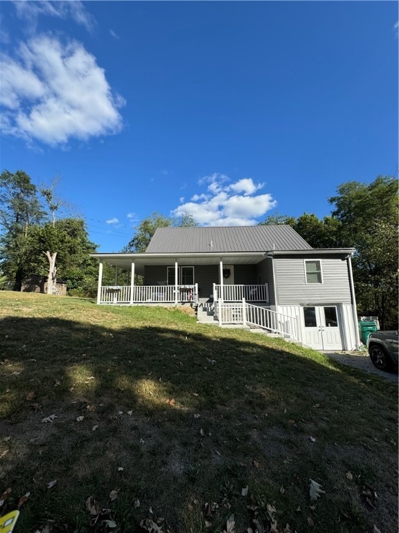 exterior space featuring a yard and covered porch