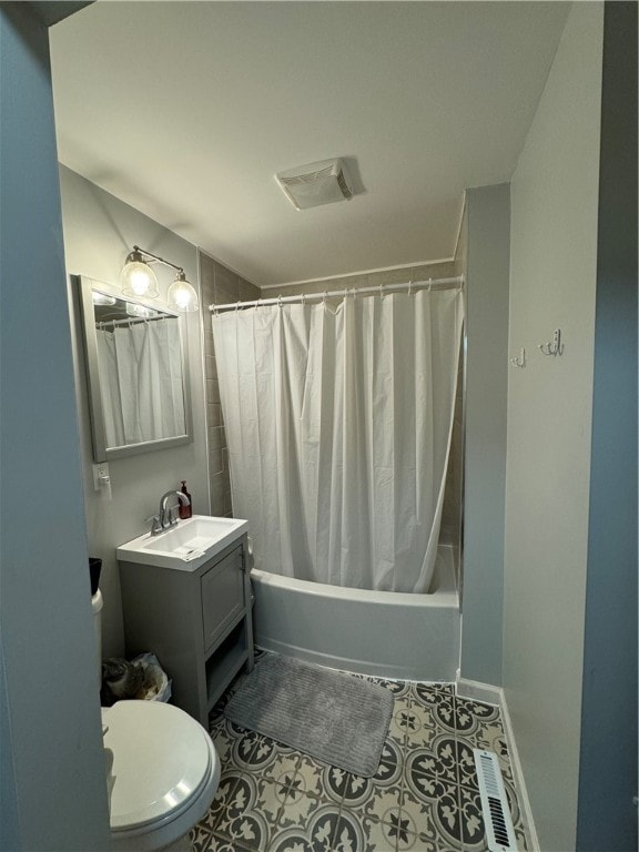 full bathroom featuring tile patterned flooring, shower / bath combination with curtain, toilet, and vanity