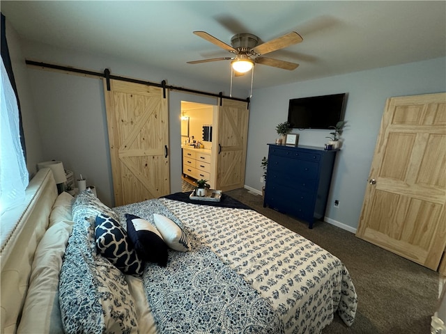 carpeted bedroom featuring ceiling fan and a barn door