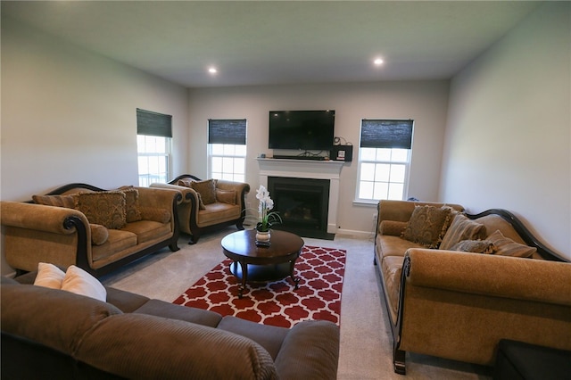 living room featuring a healthy amount of sunlight and carpet floors