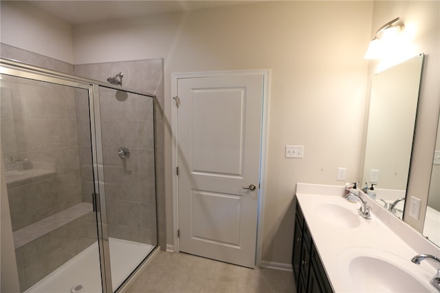 bathroom featuring vanity, tile patterned floors, and a shower with door