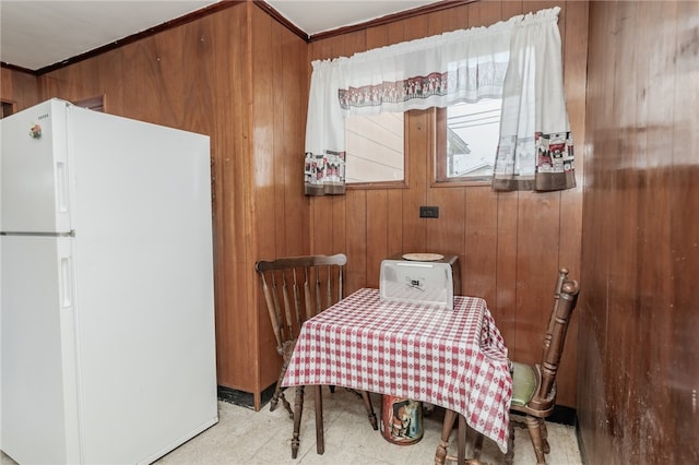 dining space with wooden walls