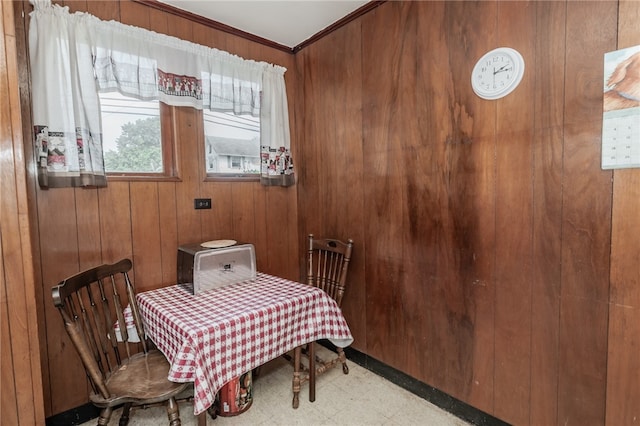 bedroom with crown molding and wooden walls