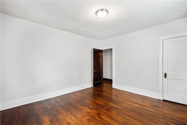 empty room featuring wood-type flooring