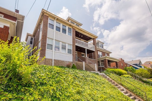 622 Bellaire Ave, Brookline, PA 15226 - back of house featuring stairway, a balcony, and brick siding