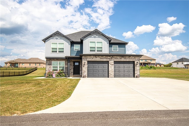 craftsman-style home featuring a garage and a front yard