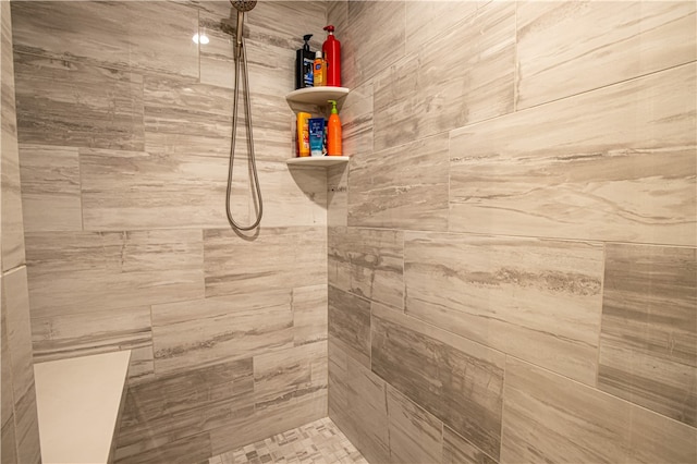 bathroom with tiled shower