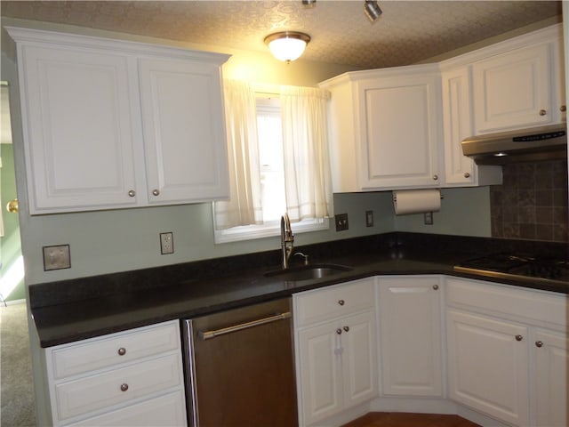 kitchen with white cabinets, stainless steel dishwasher, and sink