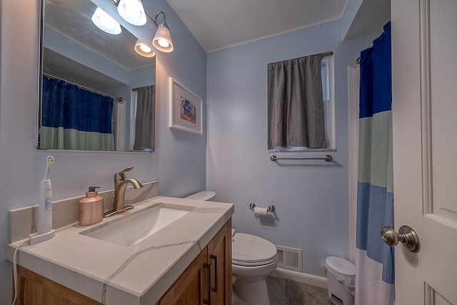 bathroom with a shower with curtain, toilet, crown molding, and vanity