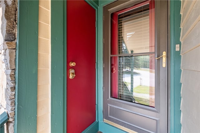 view of exterior entry with covered porch