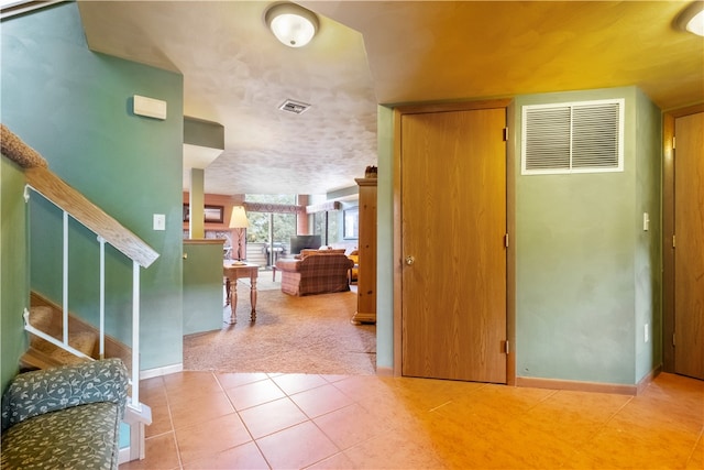 entryway with carpet floors