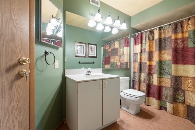 bathroom with vanity, toilet, curtained shower, and tile patterned floors