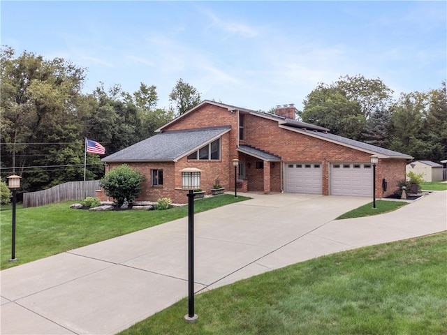 view of front of home featuring a garage and a front yard