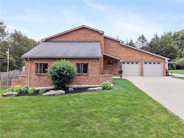 view of front of house featuring a front yard and a garage