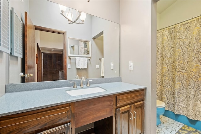 bathroom with tile patterned flooring, toilet, and vanity