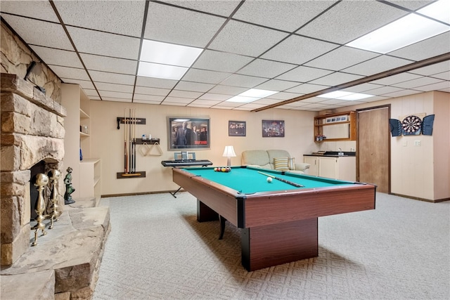 rec room featuring carpet, pool table, and a stone fireplace