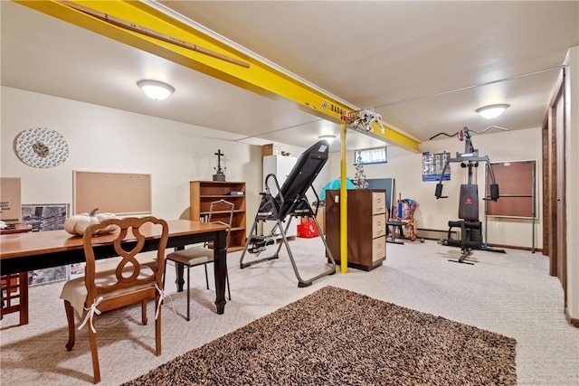 interior space with a baseboard heating unit and carpet