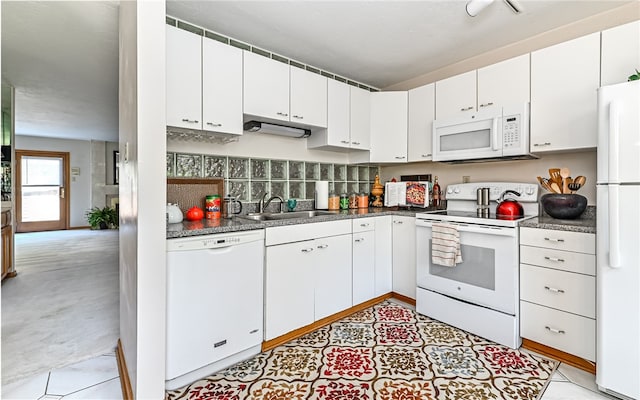 kitchen with white cabinets, white appliances, backsplash, and sink