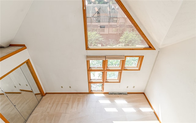 interior space featuring high vaulted ceiling