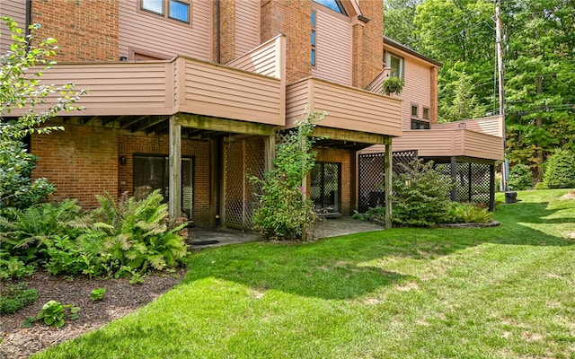 back of house with a lawn