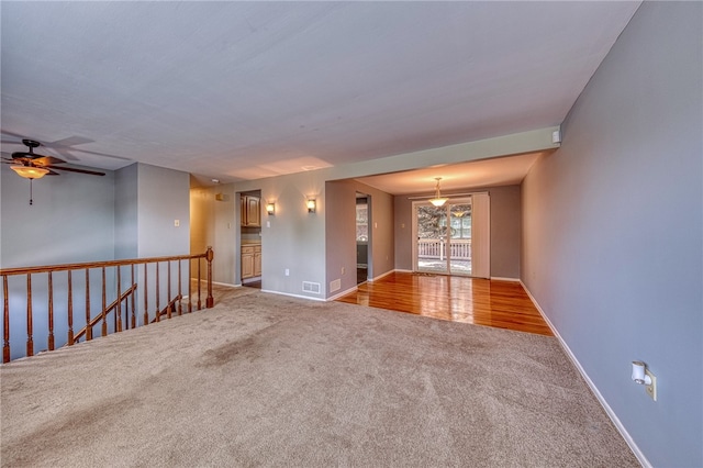 unfurnished room with light colored carpet