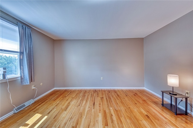 empty room with light hardwood / wood-style floors