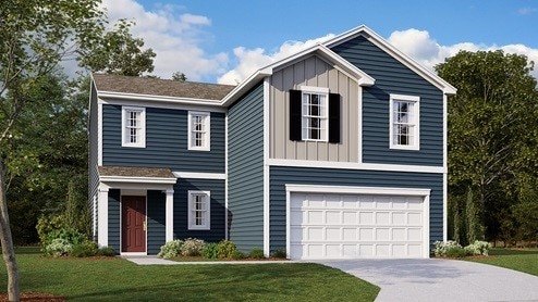 view of front of house featuring a front yard and a garage