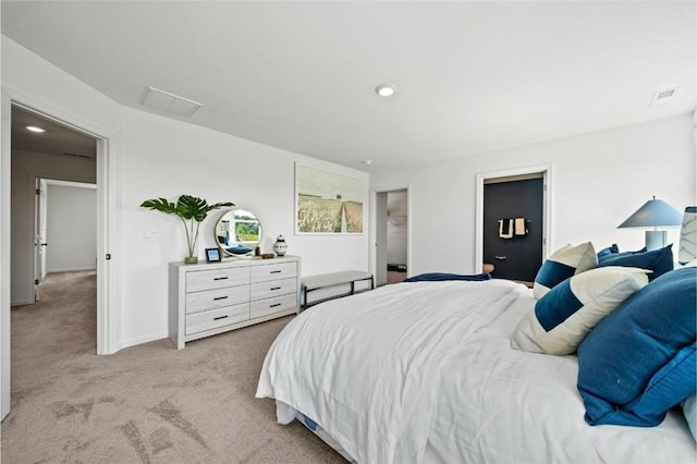 bedroom featuring light colored carpet