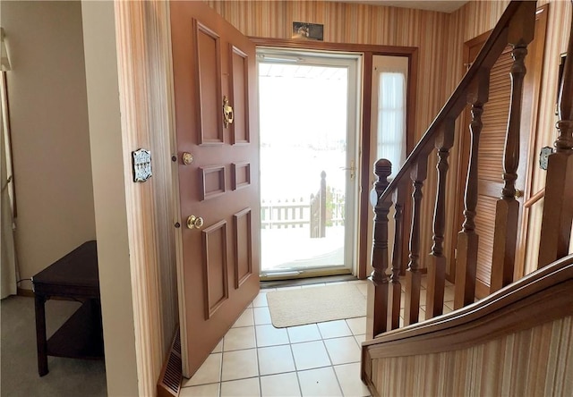 foyer featuring light tile patterned flooring