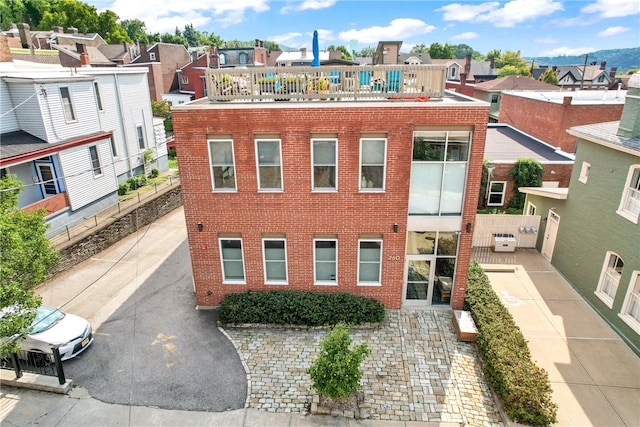 view of front of house featuring a balcony