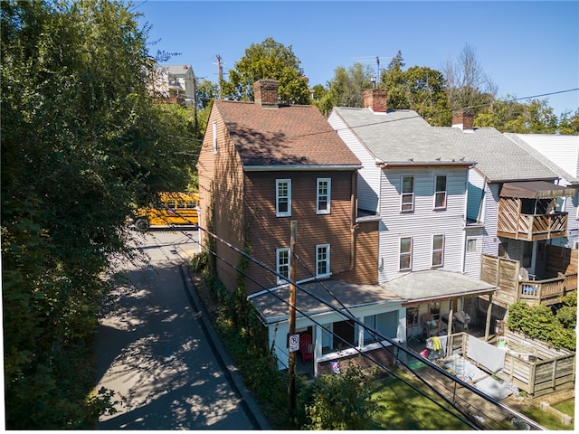 back of property featuring a balcony