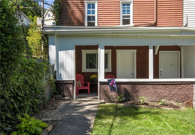 property entrance featuring covered porch