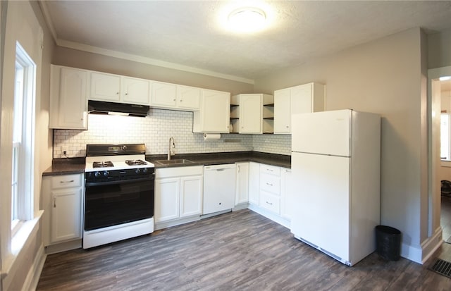 kitchen with sink, tasteful backsplash, white appliances, white cabinetry, and dark hardwood / wood-style floors