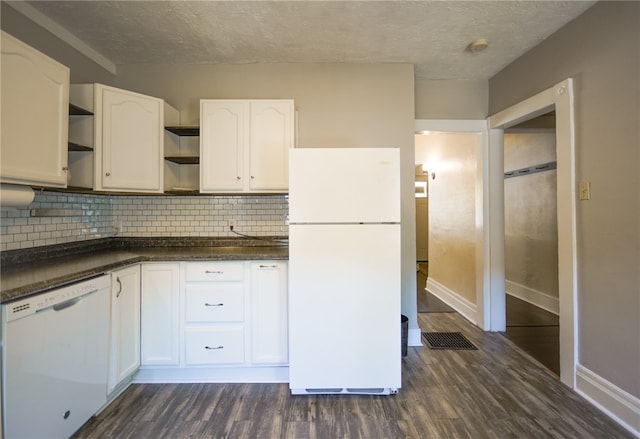 kitchen with decorative backsplash, white appliances, dark hardwood / wood-style floors, and white cabinetry